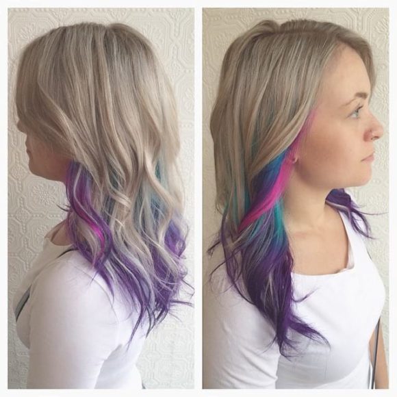 Blonde Layered Cut with Tousled Waves and Rainbow Highlights Long Hairstyle