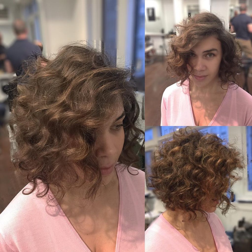 Brunette Angled Bob with Large Soft Curls and Side Part Short Hairstyle