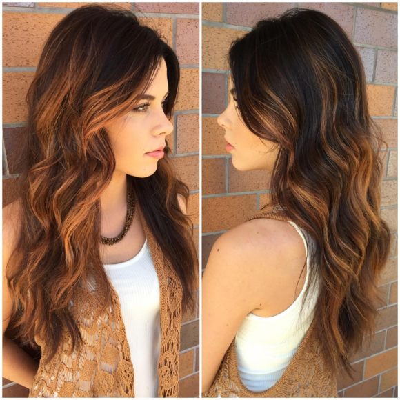Brunette Layered Cut with Tousled Waves and Warm Caramel Highlights