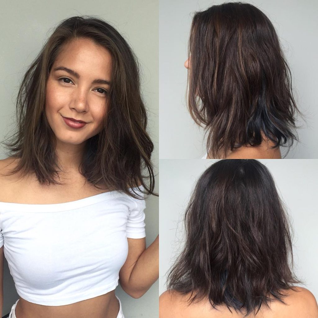 Brunette Layered Lob with Messy Beach Texture and Subtle Blue Peekaboo Highlights Medium Length Hairstyle
