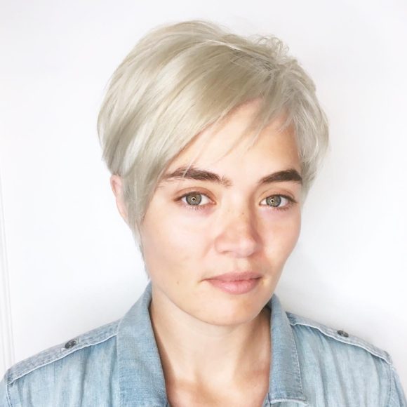 Chic Side Swept Pixie with Asymmetric Bangs and Platinum Blonde Color Short Hairstyle