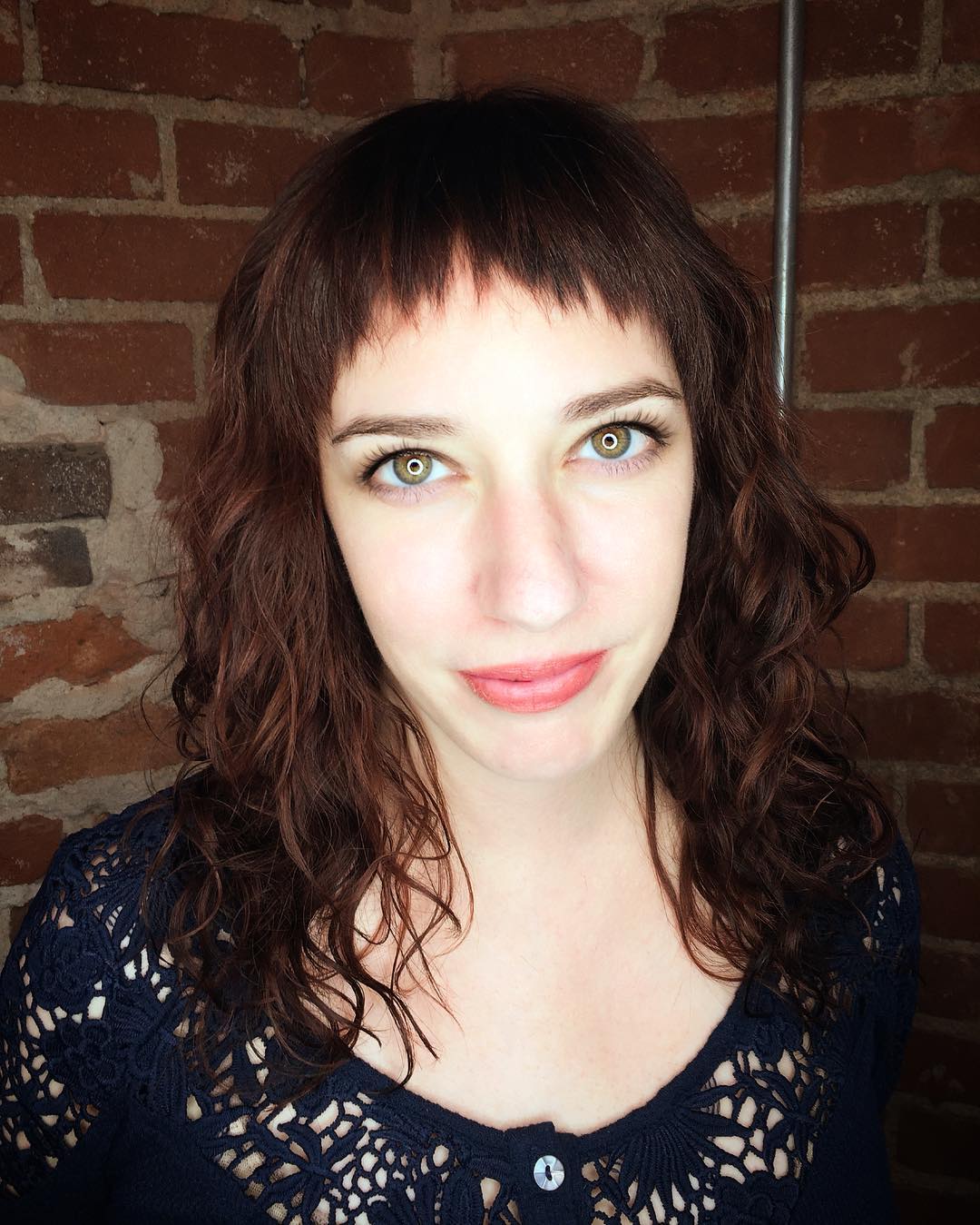 Dark Auburn Layered Cut with Undone Curly Texture and Baby Fringed