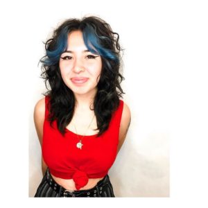 Dark Layered Lob with Undone Curly Texture and Blue Curtain Bangs Medium Length Hairstyle