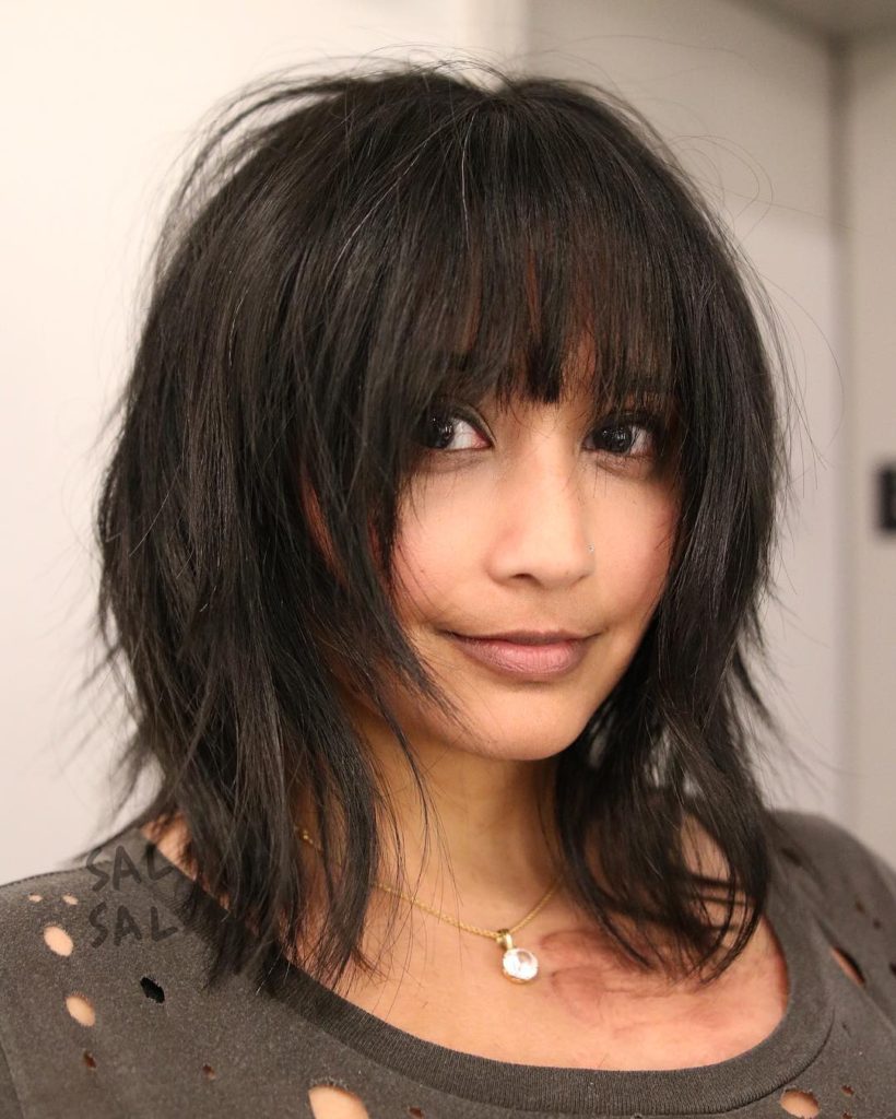 Dark Voluminous Face Framing Shag Cut with Fringe Bangs Medium Length Hairstyle