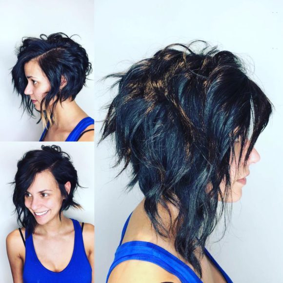 Edgy Angled Asymmetric Razor Cut Bob with Wavy Texture and Black Color