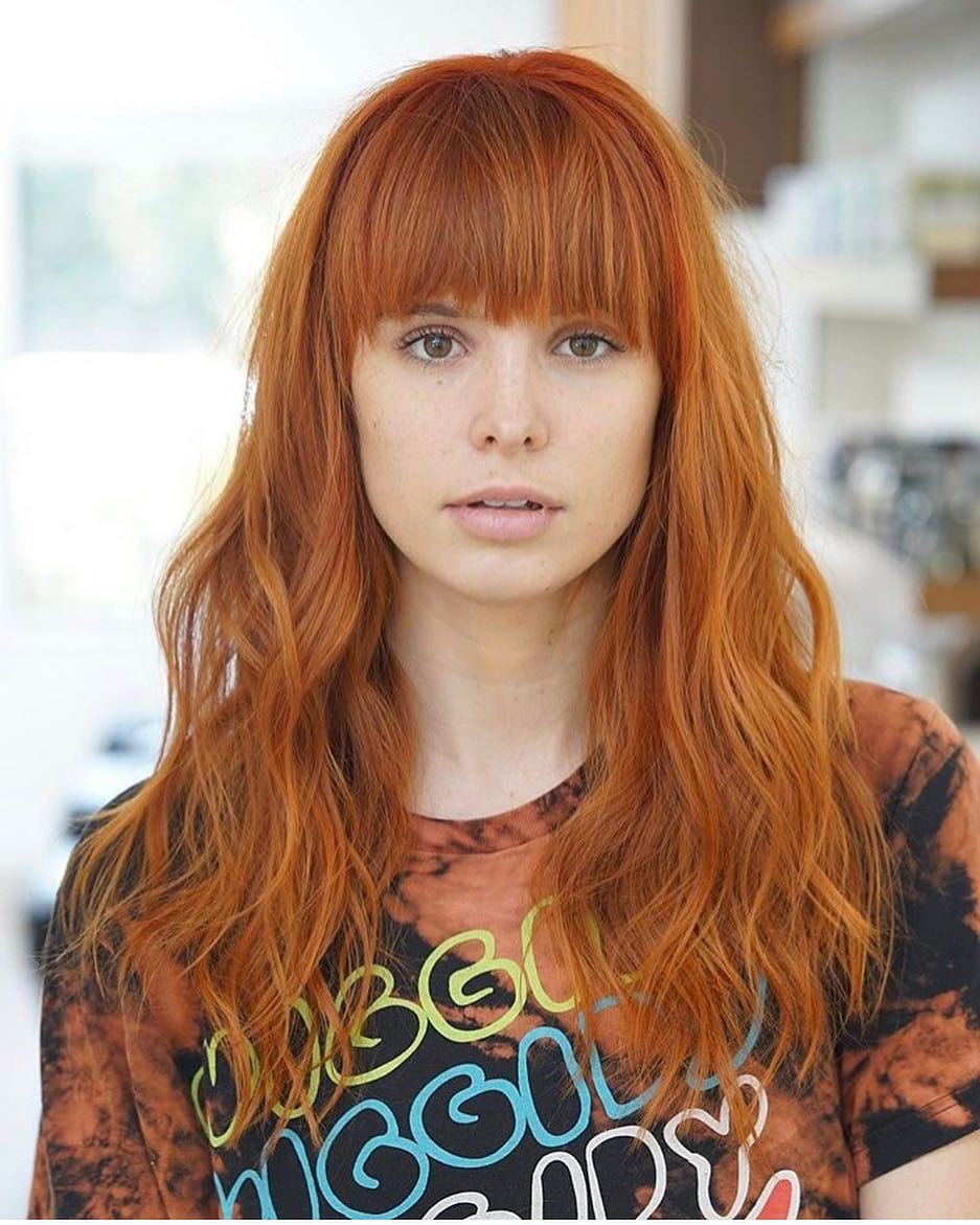 Fiery-Red-Layered-Cut-with-Full-Brow-Skimming-Bangs-and-Wavy-Texture-Long -Trendy-Fall-Hairstyle - The Latest Hairstyles for Men and Women (2020) -  Hairstyleology