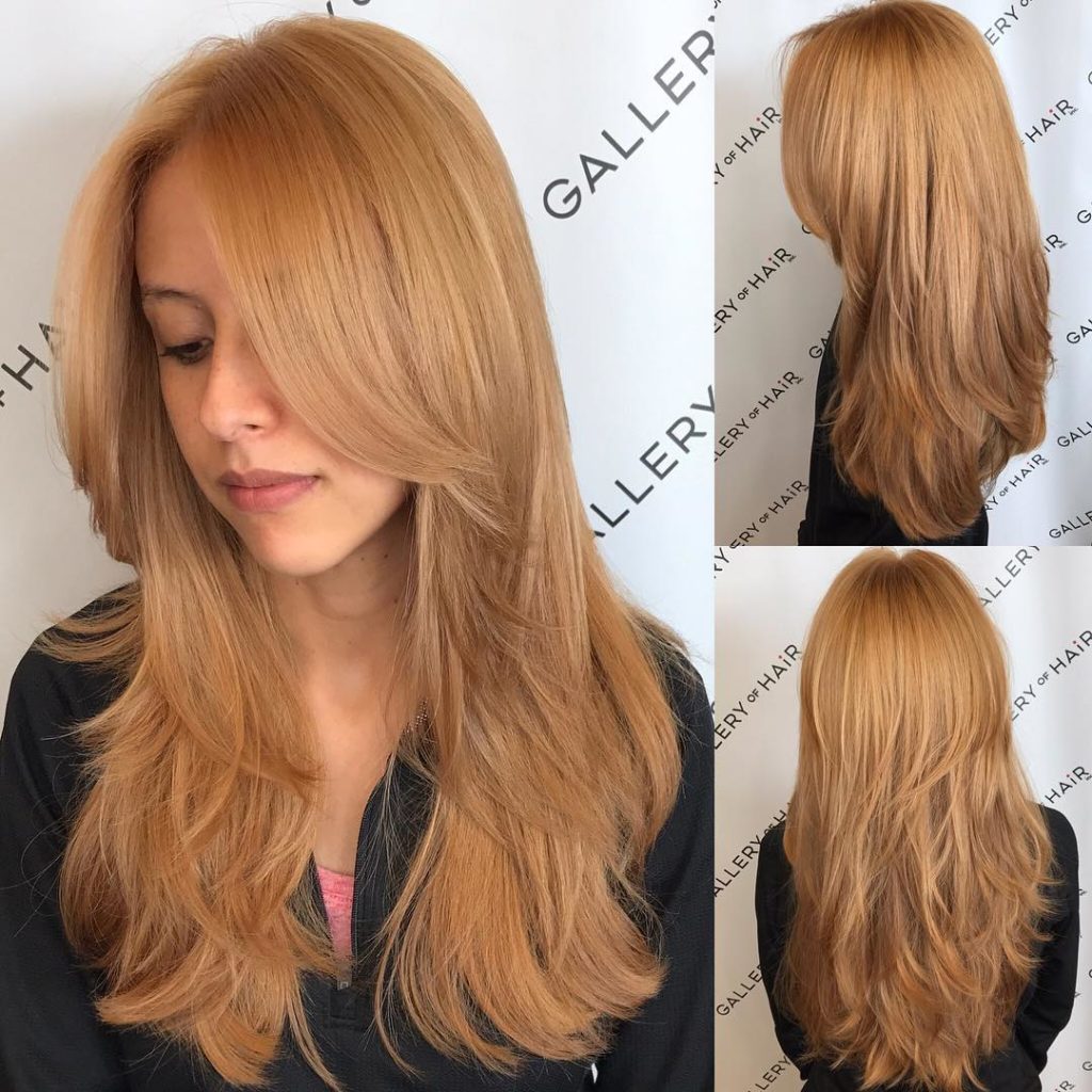 Golden Strawberry Blonde Shaggy Layered Cut with Center Part Long Hairstyle