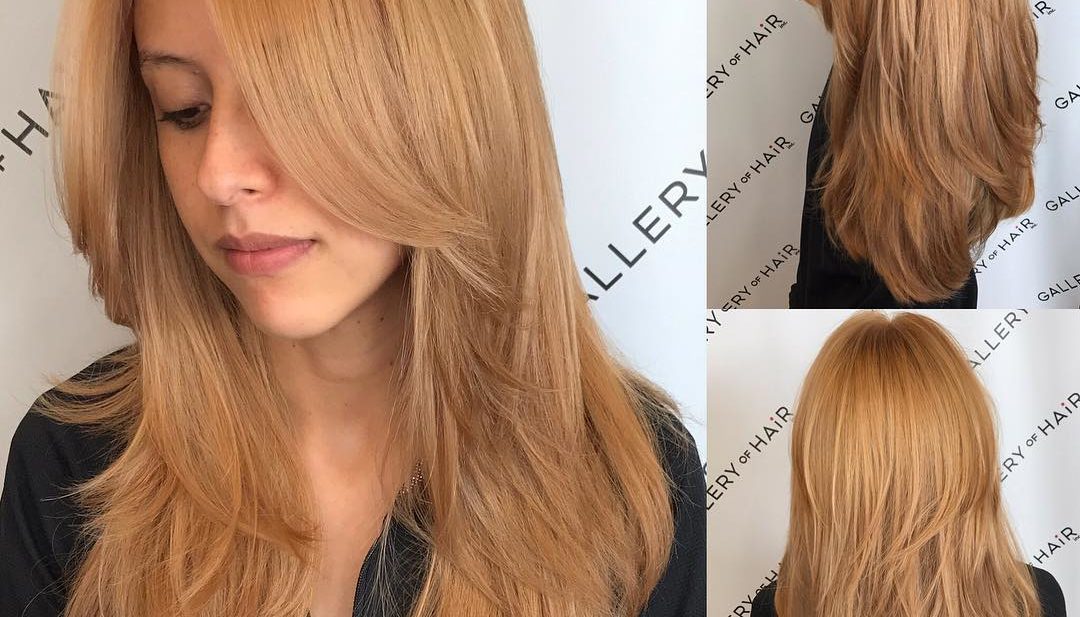Golden Strawberry Blonde Shaggy Layered Cut with Center Part Long Hairstyle
