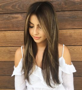 Long Messy Straight Textured Hair with Center Part and Brunette Reverse Balayage Color Long Summer Hairstyle