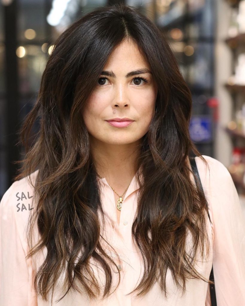 Long Parted Layered Cut with Voluminous Bohemian Waves and Brunette Balayage Long Hairstyle