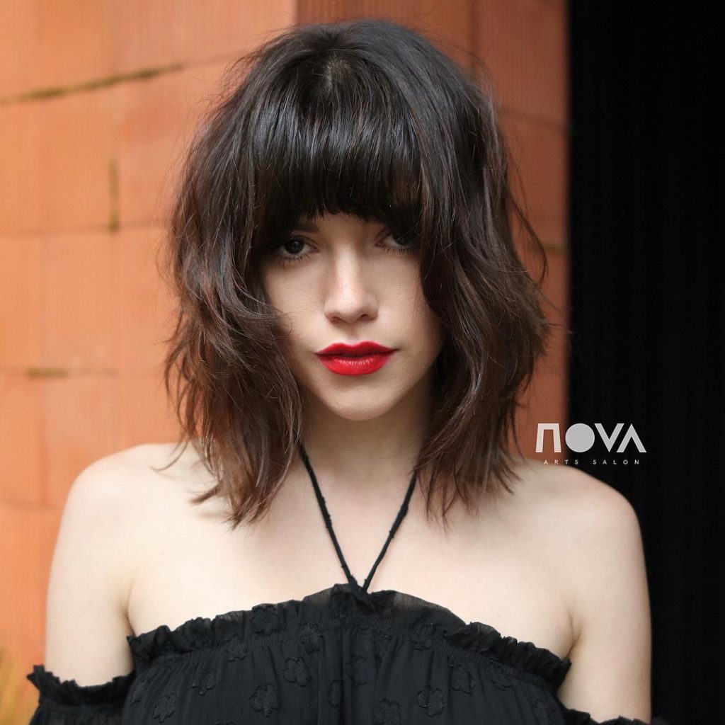 Long Shaggy Banged Bob with Messy Beach Texture and Soft Sun Kissed Brunette Balayage Medium Length Summer Hairstyle