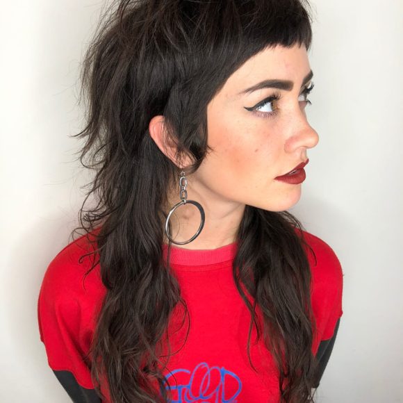 Messy Wavy Textured Shaggy Brunette Mullet with Micro Bangs and Sideburns