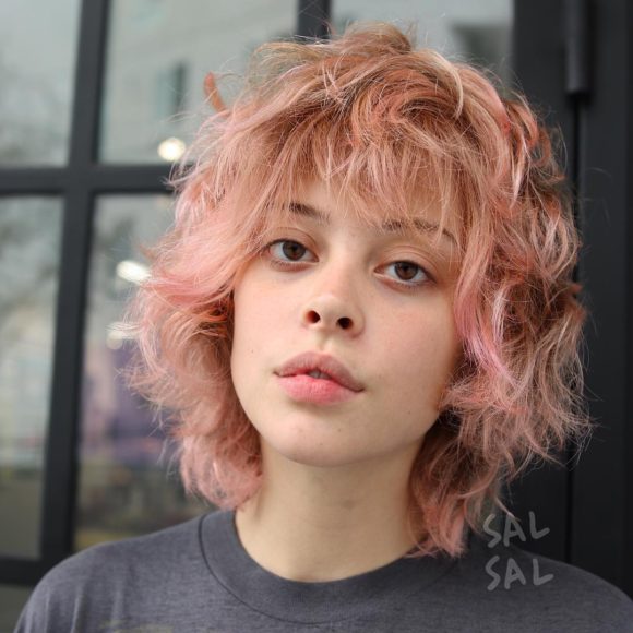 Pink Shaggy Face Framing Bob with messy Waves and Bangs