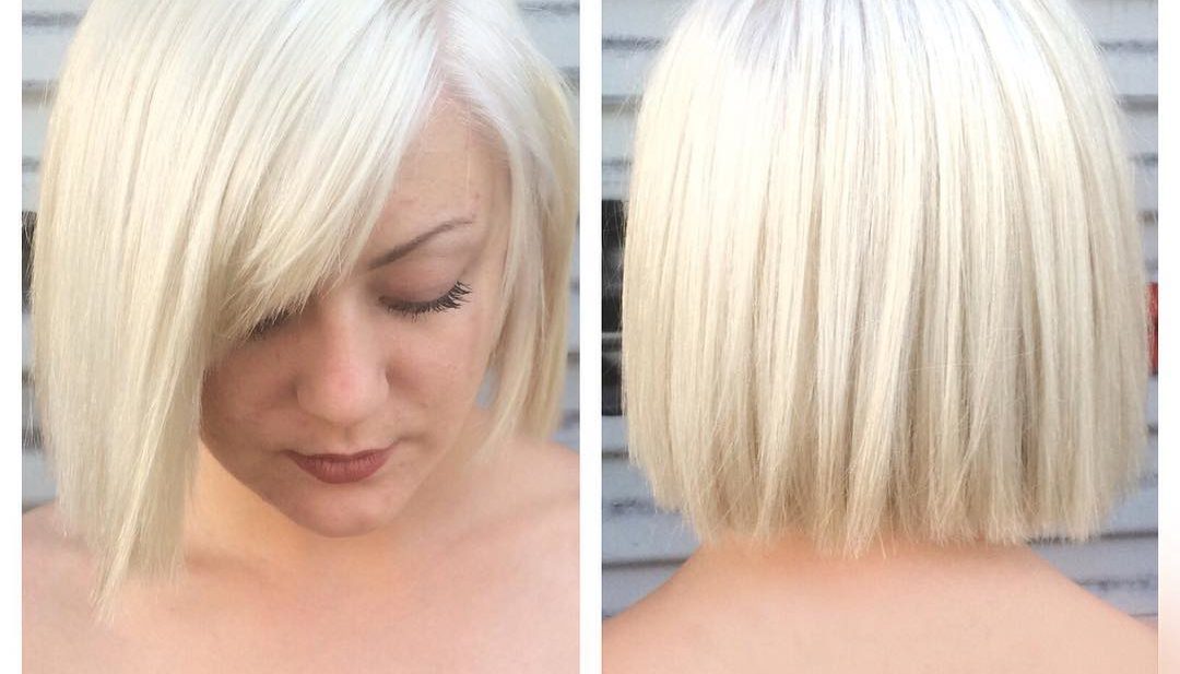 Platinum Blunt Cut Bob with Textured Ends and Side Swept Bangs Short Hairstyle