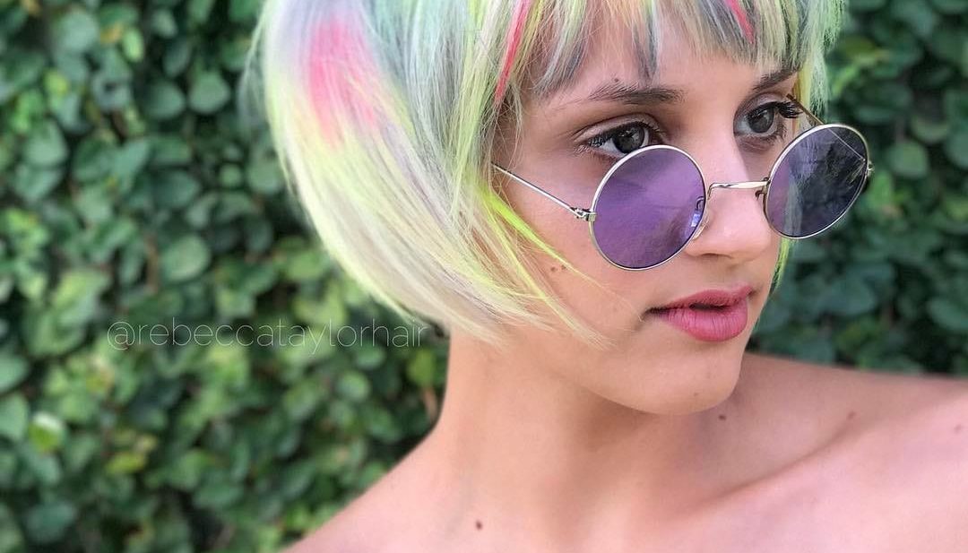 Platinum Messy Textured Bob with Choppy Bangs and Neon Rainbow Highlights Short Summer Hairstyle
