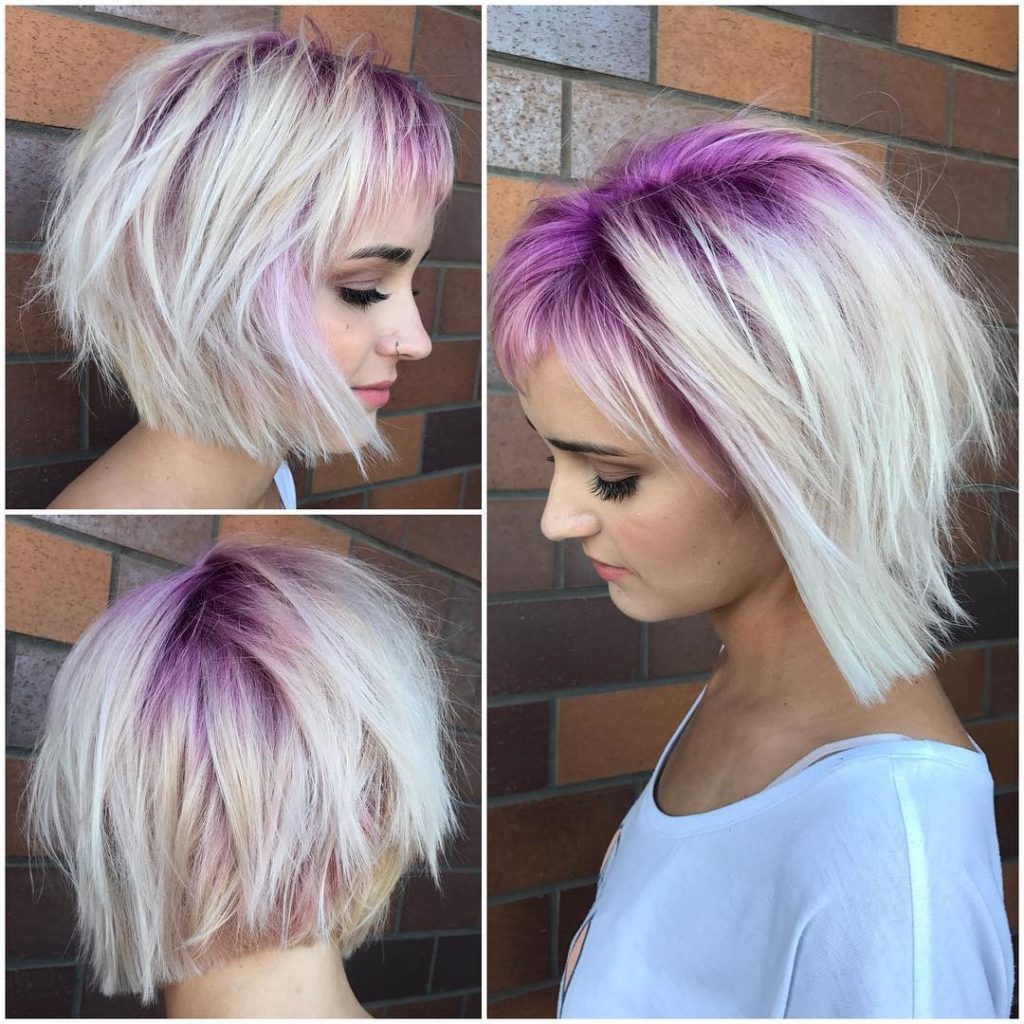 Platinum Stacked Bob with Choppy Bangs and Pink Shadow Roots Short Hairstyle