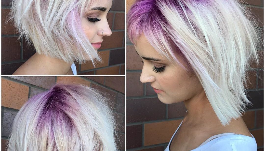 Platinum Stacked Bob with Choppy Bangs and Pink Shadow Roots Short Hairstyle