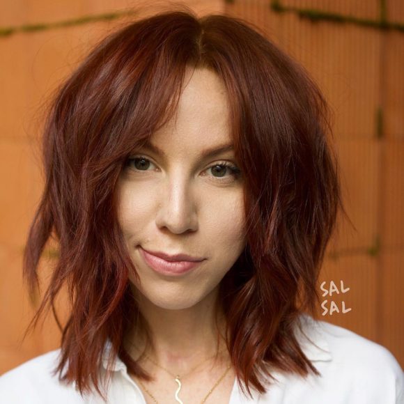 Shaggy Auburn Lob with Voluminous Soft Wavy Texture and Curtain Bangs