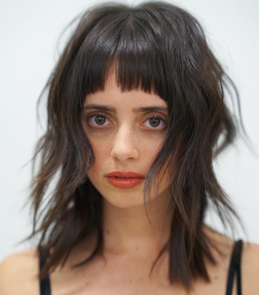 Shaggy Brunette Fringe Cut with Messy Wavy Beach Texture and Bangs Medium Length Summer Hairstyle