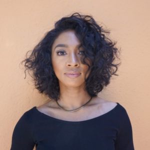 Shaped Textured Bob with Dramatic Side Part and Wavy Curls Medium Length Hairstyle