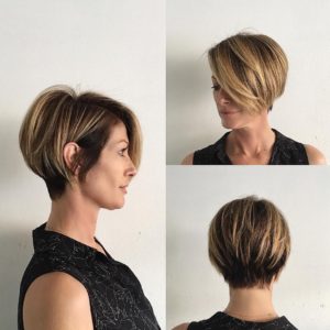 Short Blonde Highlighted Bob with Stacked Layers and Long Side Swept Bangs Short Hairstyle