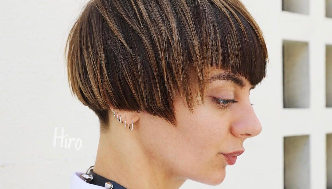 Short Highlighted Brunette Bob with Allover Textured Razor Cut Layers and V Shaped Bangs Short Fall Hairstyle