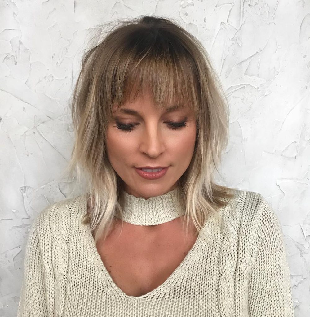 Shoulder Grazing Shaggy Fringe with Messy Wavy Texture and Blonde Lived in Color Hair Painting Medium Length Fall Hairstyle