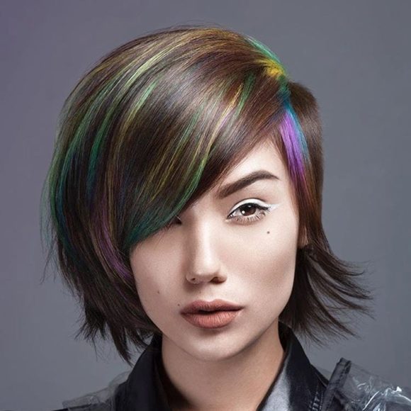 Side-Shaved Undercut Pixie-Bob with Full Side Swept Bangs and Rainbow Highlights