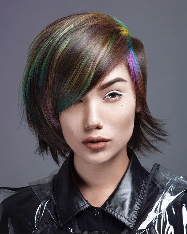 Side-Shaved Undercut Pixie-Bob with Full Side Swept Bangs and Rainbow Highlights