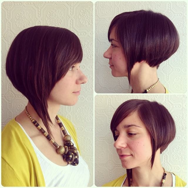 Sleek Asymmetric Angled Bob with Side Swept Bangs and Warm Brunette Color Short Hairstyle