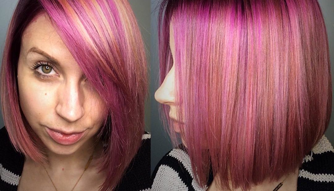 Sleek Peachy Pink Highlighted Bob with Side Swept Bangs Medium Length Hairstyle