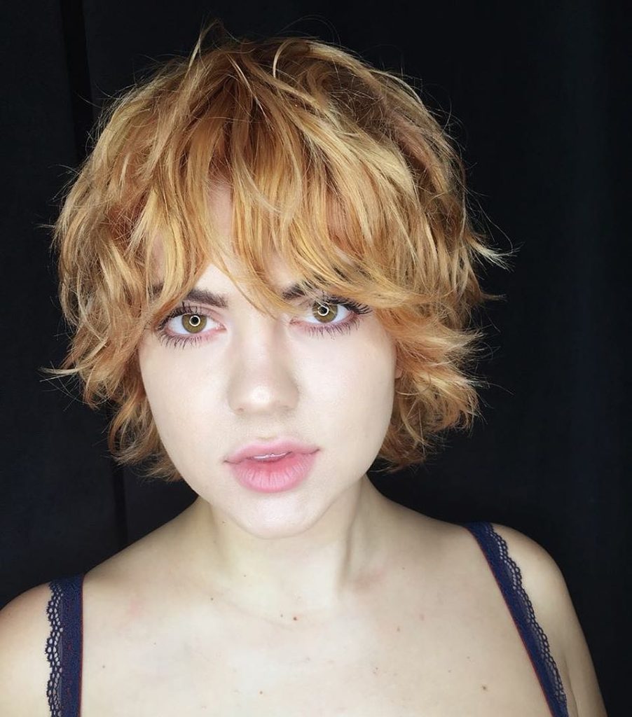 Strawberry Blonde Shag with Undone Textured Waves and Bangs Short Hairstyle