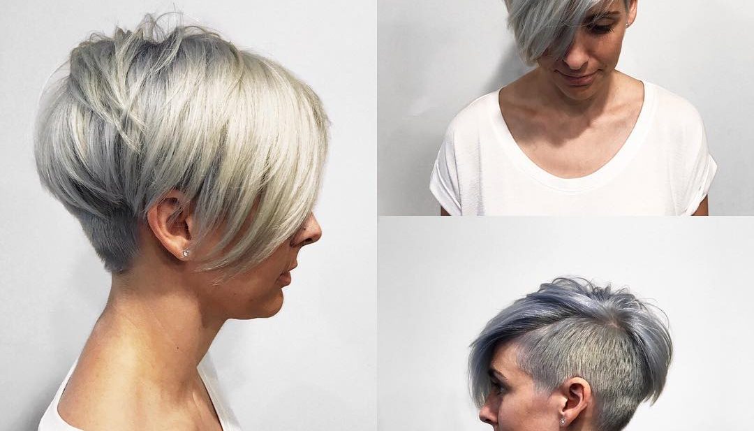 Textured Platinum Undercut Pixie with Long Side Swept Bangs and Metallic Silver Shadow Roots