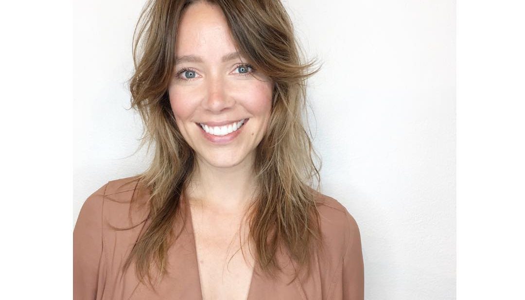 Undone Shaggy Razor Cut with Curtain Bangs and Soft Golden Balayage Long Hairstyle