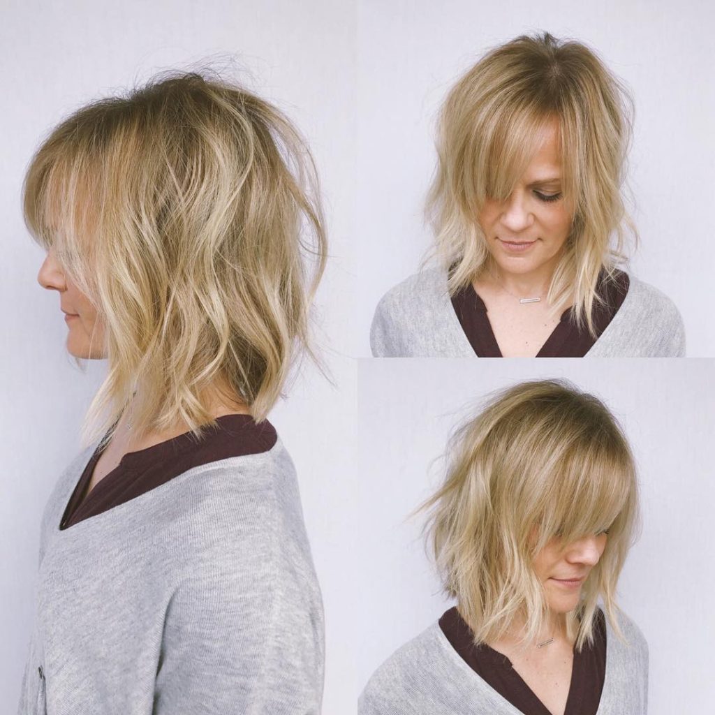 Undone Wavy Textured Bob with Parted Side-Swept Bangs and Blonde Balayage Medium Length Hairstyle
