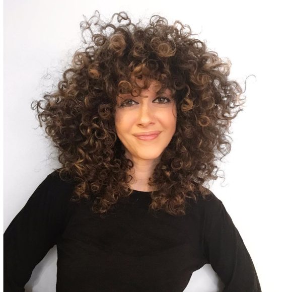 Voluminous Brunette Textured Cut with Spiral Curls and Highlights