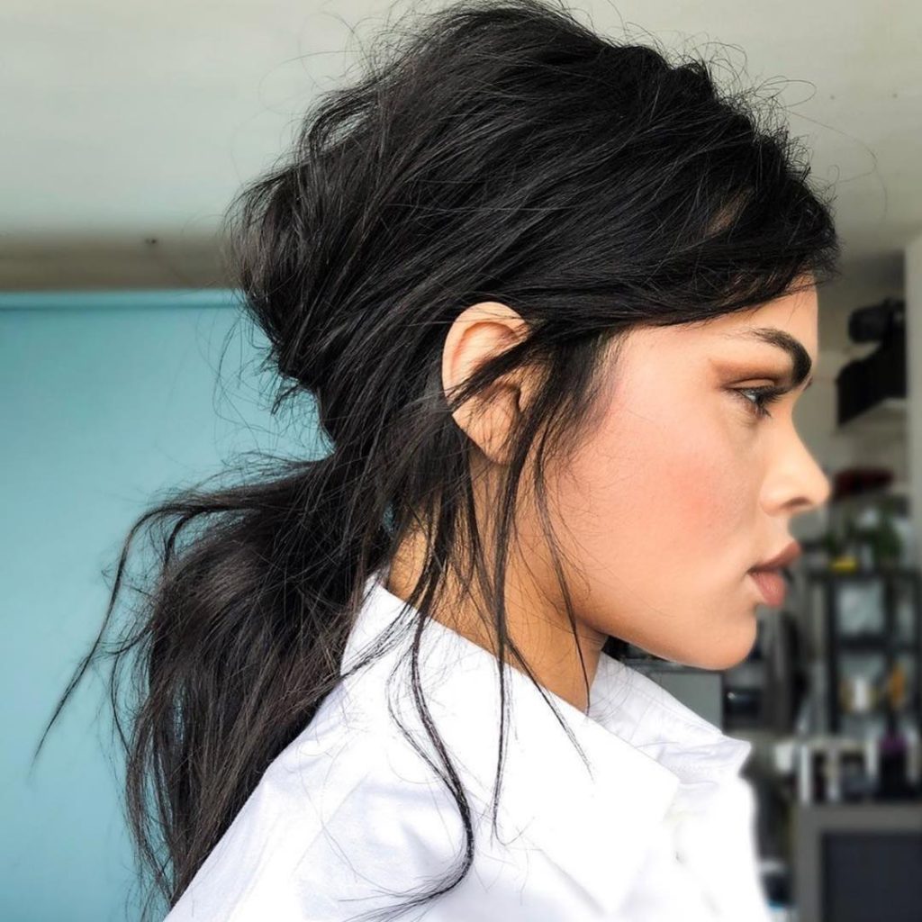 Voluminous Messy Ponytail with Loose Face Framing Pieces on Dark Brunette  Hair - The Latest Hairstyles for Men and Women (2020) - Hairstyleology