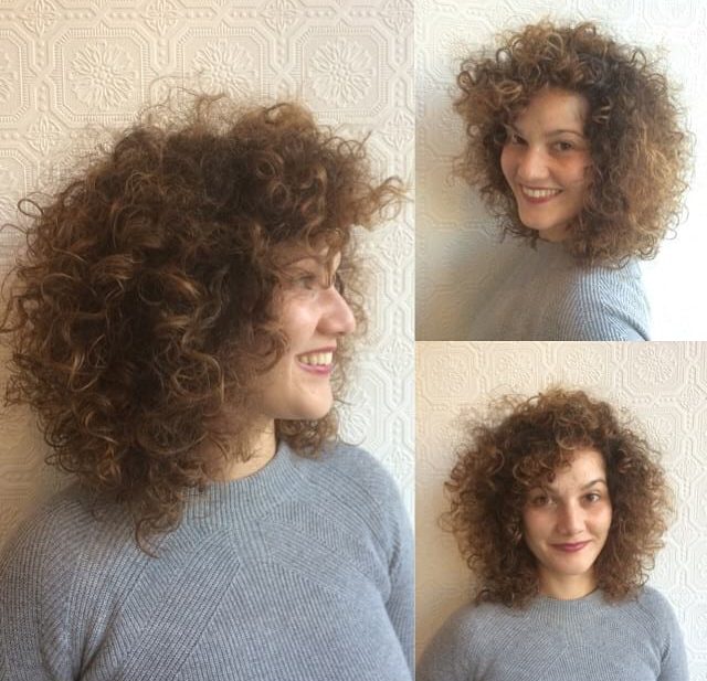 Voluminous Tousled Curly Bob with Curly Side Swept Bangs and Sun Kissed Caramel Ombre Medium Length Hairstyle