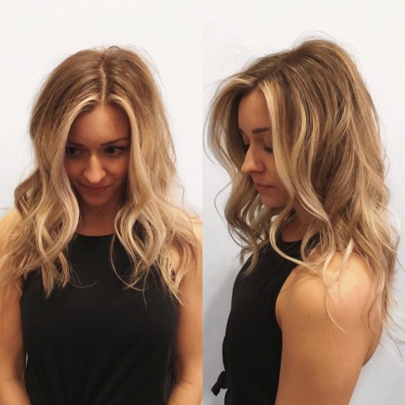 Wavy Layered Cut with Center Part and Subtle Blonde Balayage Long Hairstyle