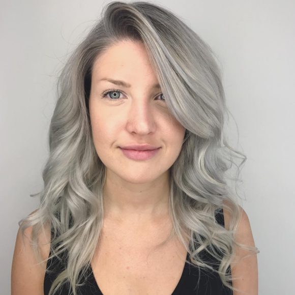 Wavy Layered Cut with Long Side Swept Bangs and Grey Blend Color