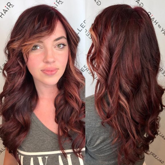 Wavy Layered Cut with Vibrant Burgundy Color and Side Swept Bangs - The ...
