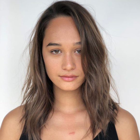 Wavy Textured Hair with Seamless Layers and Soft Chocolate Brown Color