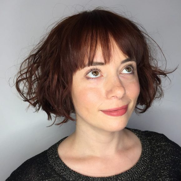 Wild Waves on a Short Dark Red Bob with Brow Skimming Bangs
