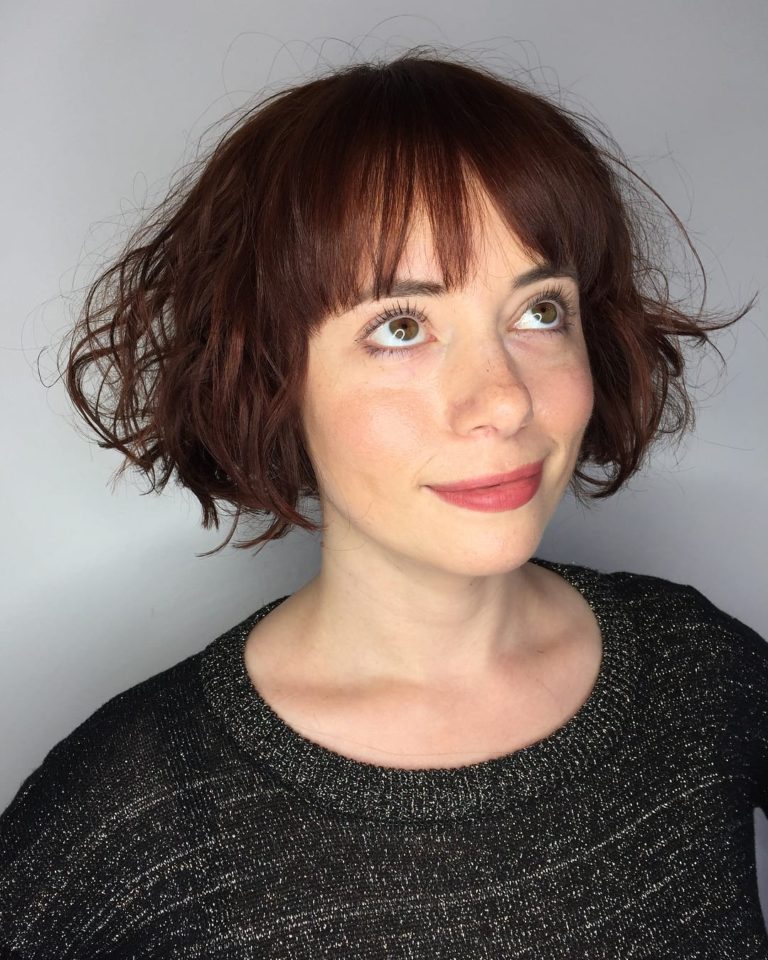 Wild Waves on a Short Dark Red Bob with Brow Skimming Bangs - The ...