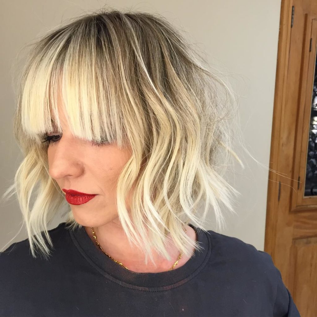 Long Blonde Bob with Choppy Layers and Full Bangs