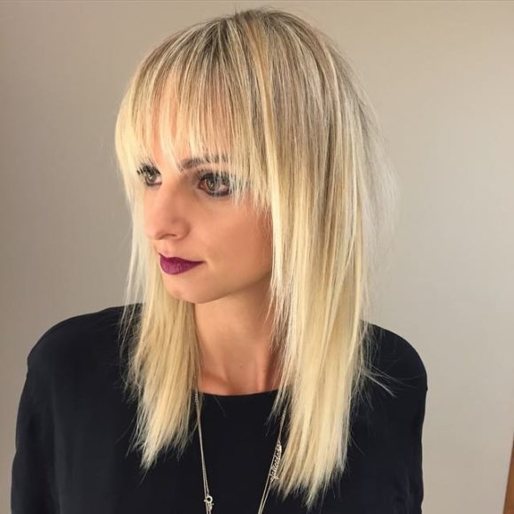 Long Blonde Shaggy Layered Cut with Fringe Bangs
