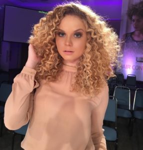 Long Layered Hair with Spiral Curls on Strawberry Blonde Hair with Dark Roots