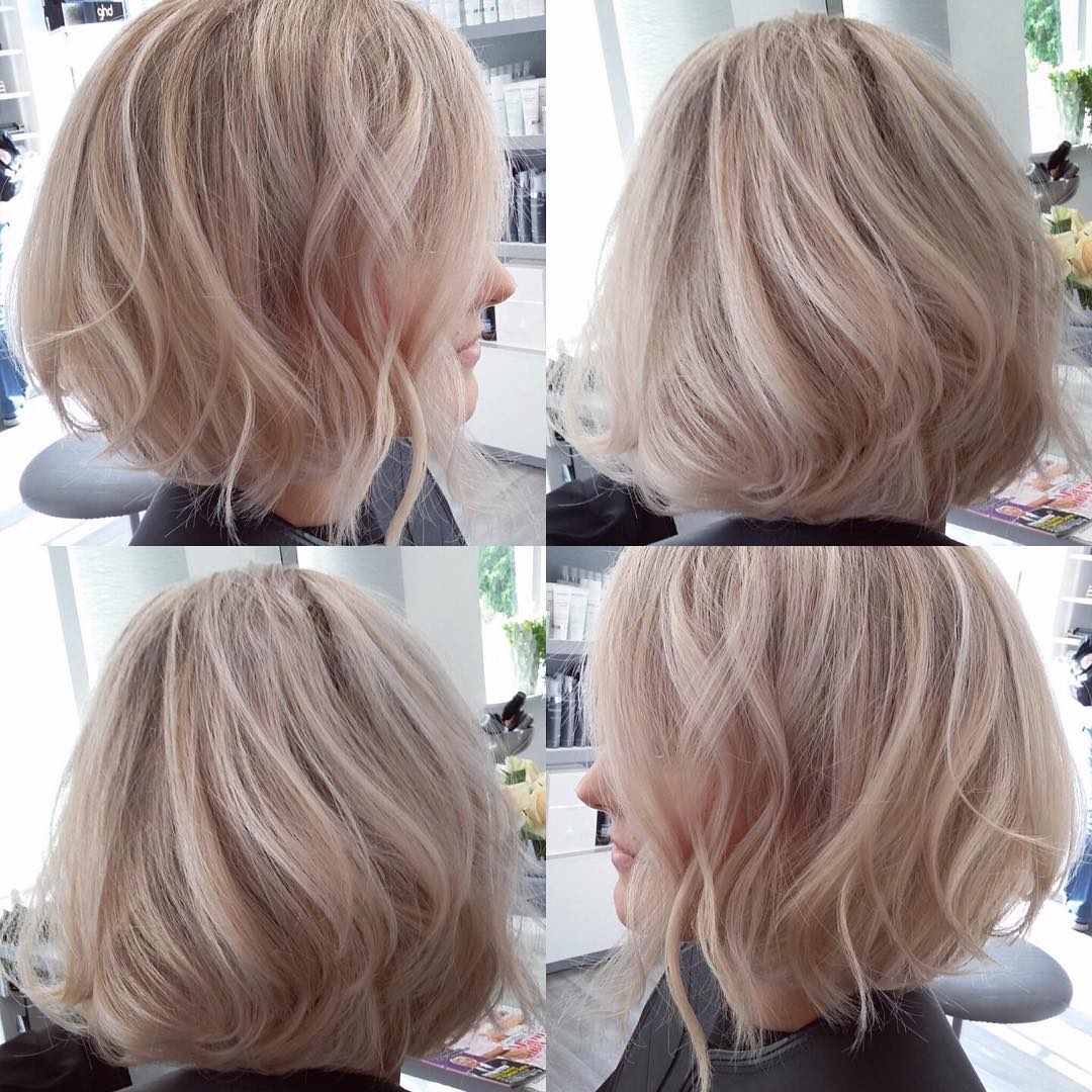 Blowout Angled Bob with Tousled Waves on Blonde Hair with Platinum  Highlights - The Latest Hairstyles for Men and Women (2020) - Hairstyleology